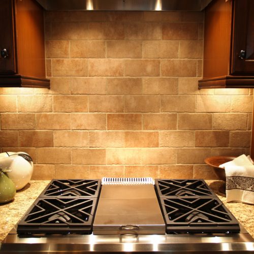 A modern cooktop in a kitchen in an upscale luxurious american home